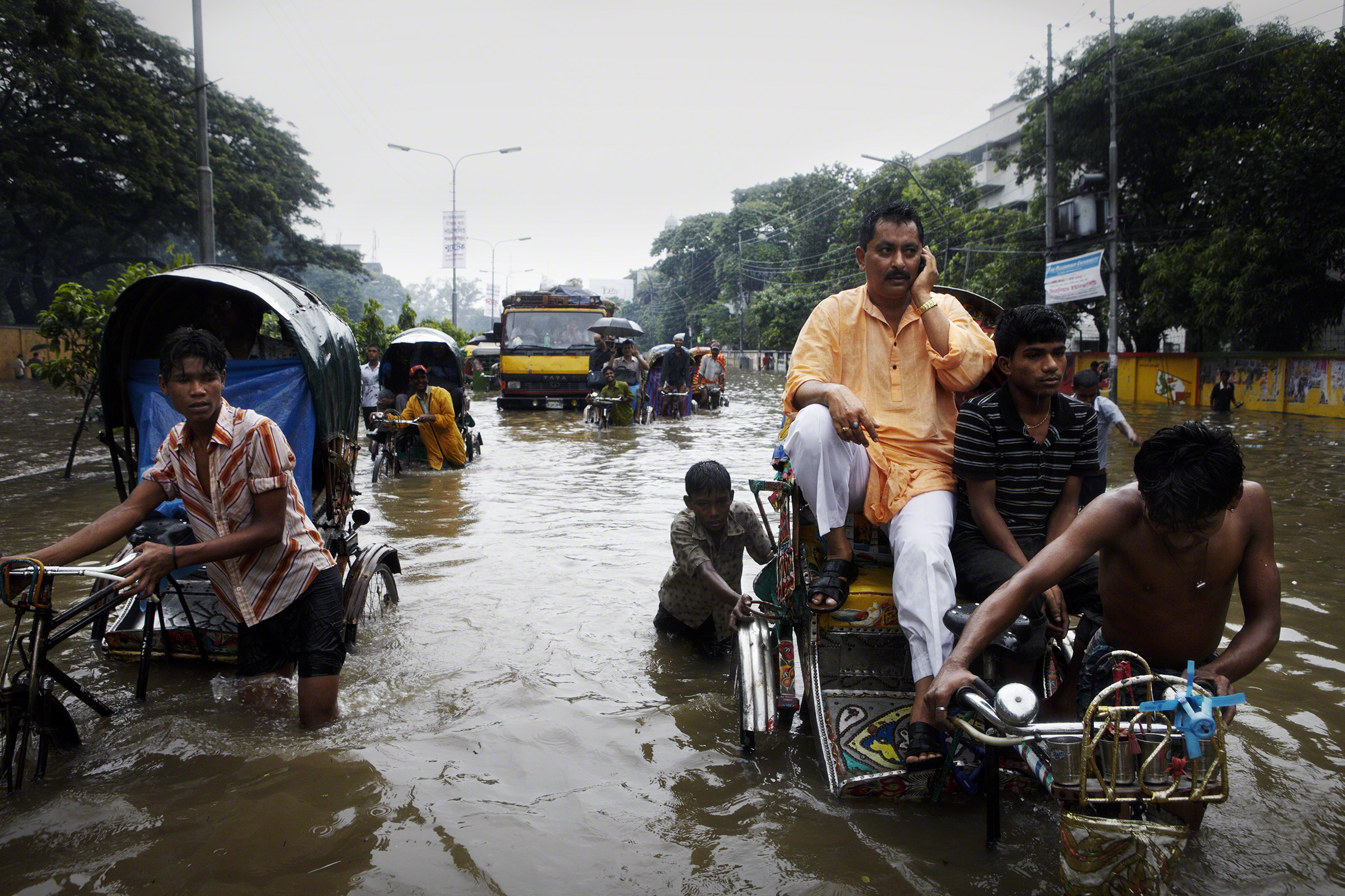 Arambagh, Dhaka, Bangladesh, 2009. After a night of heavy rain, Dhaka experienced widespread flooding around the city. Photo: Jonas Bendiksen  
