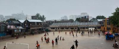 Children play in monsoon flooded school in Bangladesh