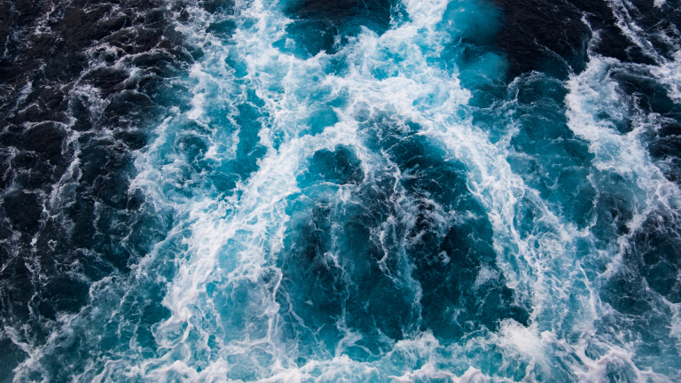 An aerial view of blue water on a ship.