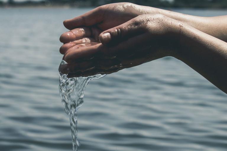 Hands holding water