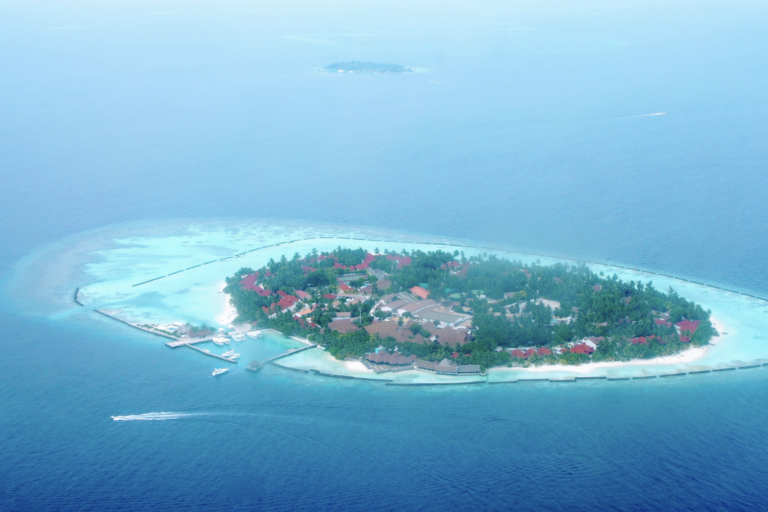 An aerial view of an island in the middle of the ocean.