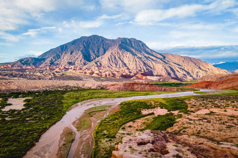 Aerial Drone Above Cafayate Vineyards and Town, Scenic Grape Production Field and Agricultural Village next to Andean Cordillera, Salta, Argentina