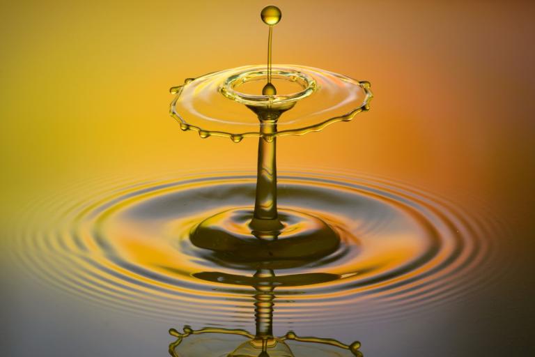 A drop of water on a yellow background