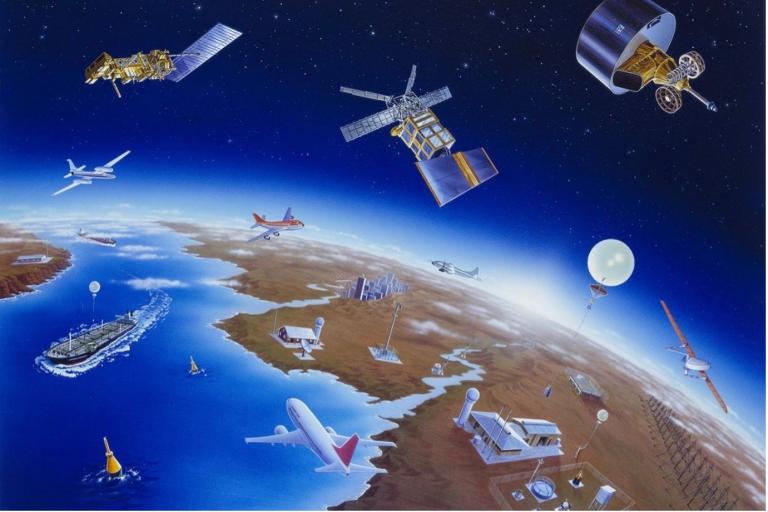 Illustration of various satellites orbiting earth with airplanes, ships, and ground stations visible, depicting global communication networks.