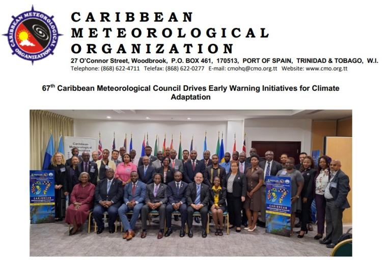 Group photo of the Caribbean Meteorological Organization's 67th council, featuring numerous participants standing and seated, with flags in the background.