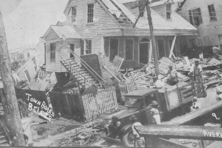 Broken and damaged piled-up objects and house
