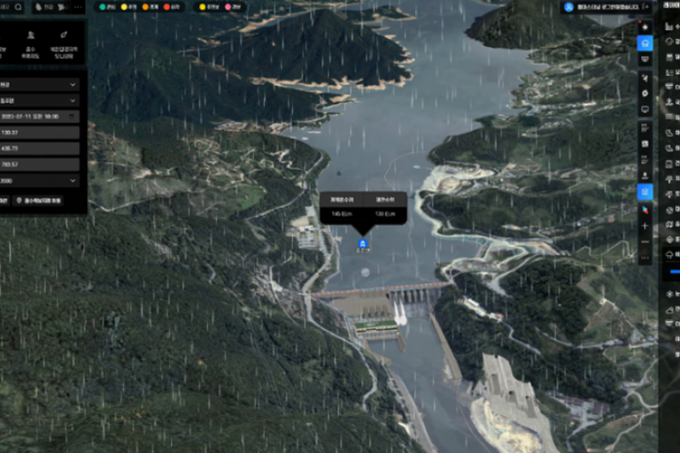A satellite map interface shows a dam on a river surrounded by forested mountains, with data panels and weather effects displayed on the screen.