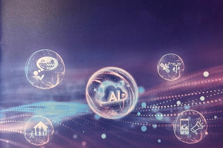 A digital graphic shows a central "AI" icon surrounded by four circular icons representing business, healthcare, engineering, and communication, on a purple abstract background.