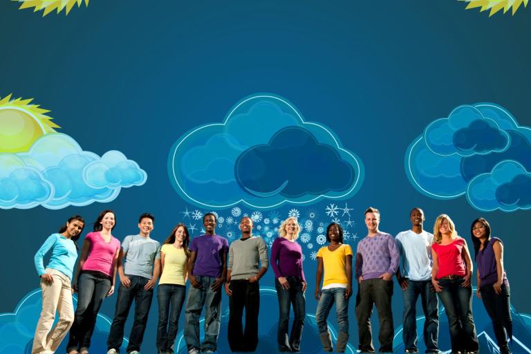 A diverse group of people stands in front of a blue background with illustrated clouds, sun, and snowflakes.