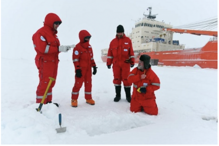 The members of the Roshydromet Transarctic expedition are taking snow samples for isotope analysis