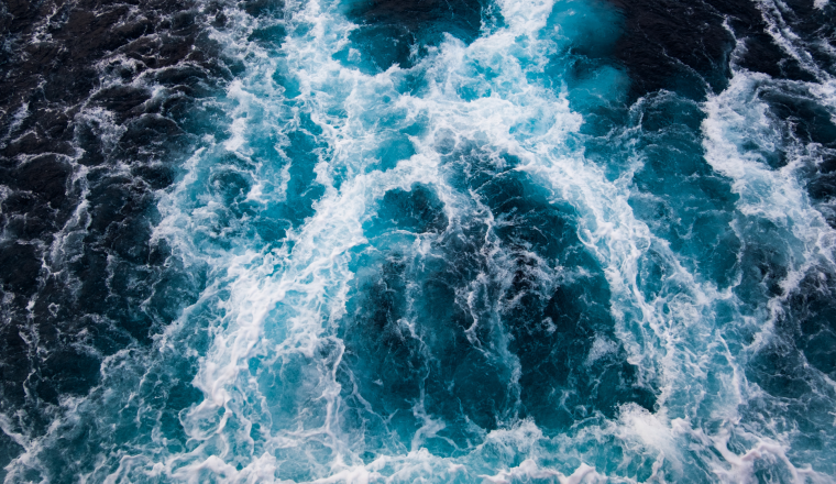 An aerial view of blue water on a ship.