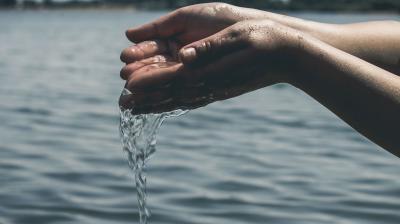 Hands holding water