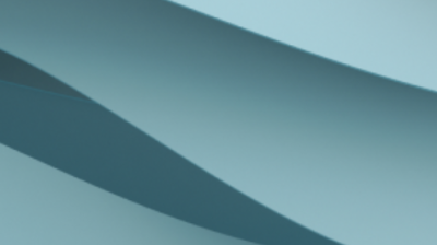 Abstract image with overlapping light and dark blue curved shapes, creating a soft and flowing pattern.