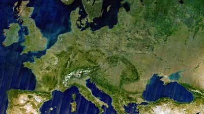 Satellite view of Europe showing landmasses, mountain ranges, and surrounding bodies of water. Countries and borders are not marked.