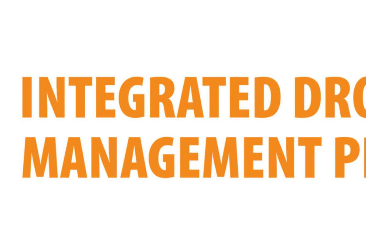 Integrated Drought Management Programme logo featuring an orange circle with a sun, landscape, and cracks, alongside the program name in bold orange text.