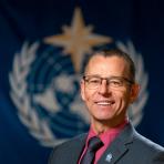 Johan Stander in front of WMO flag.