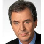 A close up of a man in a suit and tie.