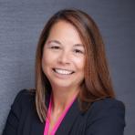 Katie Jereza in a business suit.