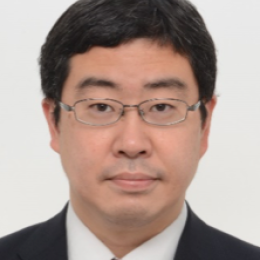 An asian man in a suit and tie.