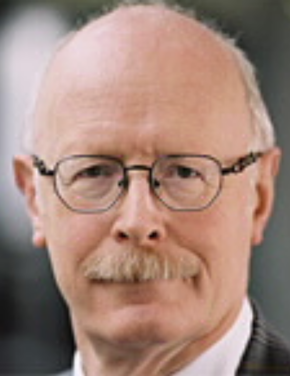 A bald man with glasses and a mustache.