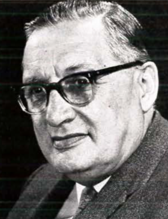 A black and white photo of a man wearing glasses.