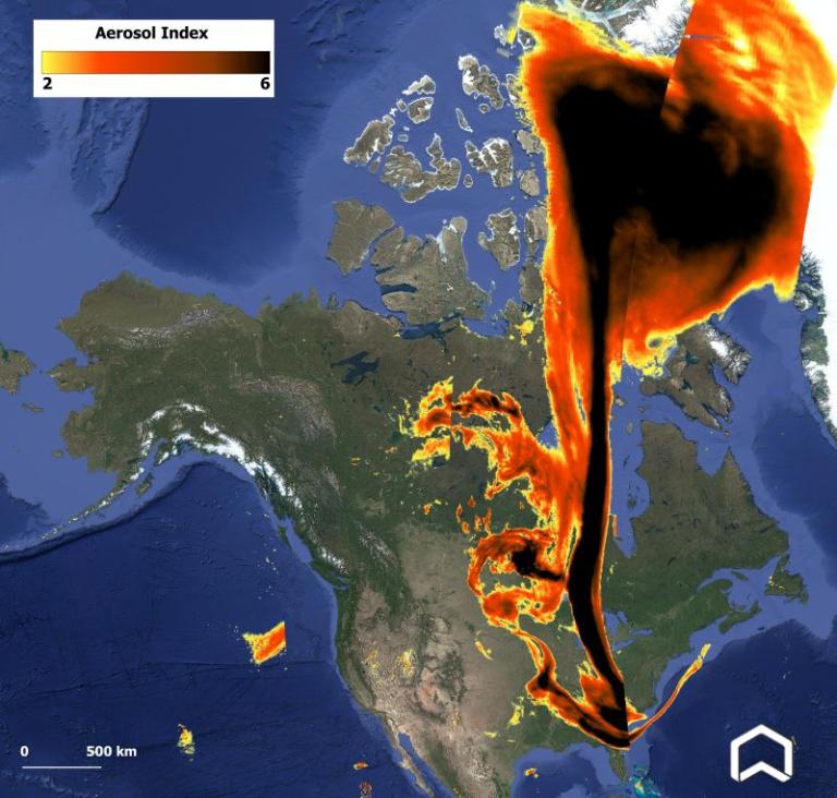 Satellite image showing aerosol index levels over North America, with large, dark plume indicating high concentration spreading from eastern Canada to the southeastern United States.