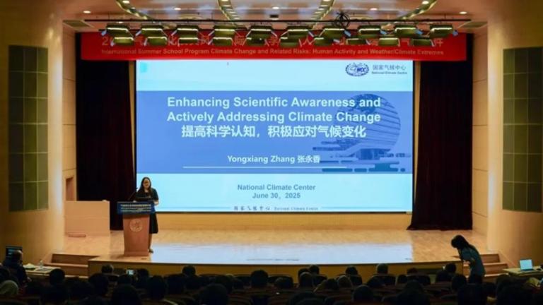 Speaker presenting a lecture on enhancing scientific awareness and addressing climate change at the National Climate Center on June 30, 2025.