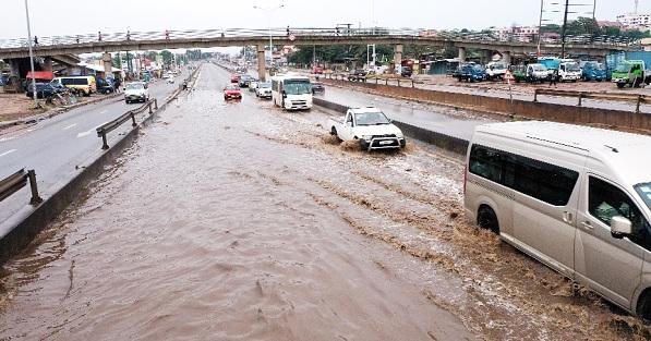 Vehicles driving on flooded roads