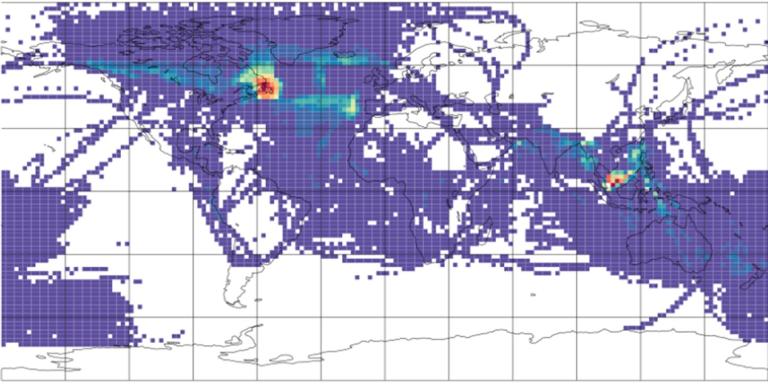 Heatmap of global flight traffic density showing highest concentrations over eastern United States and western Europe, with lighter activity across other major flight paths worldwide.