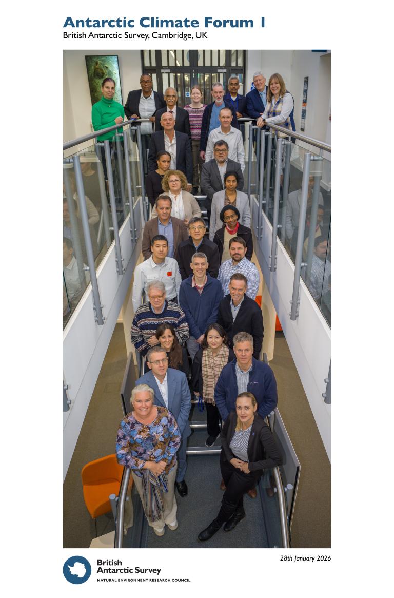 A group of people stands on stairs and a landing, posing for a photo at the Antarctic Climate Forum I, British Antarctic Survey, Cambridge, UK.