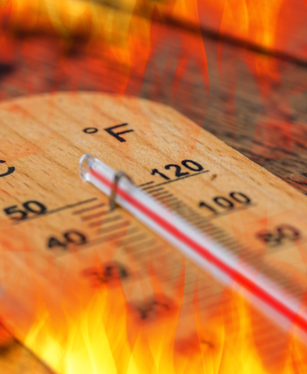 A thermometer shows high temperatures in both Celsius and Fahrenheit, surrounded by flames, suggesting intense heat or extreme temperature.