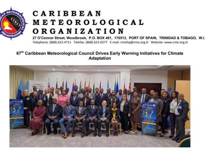 Group photo of the Caribbean Meteorological Organization's 67th council, featuring numerous participants standing and seated, with flags in the background.