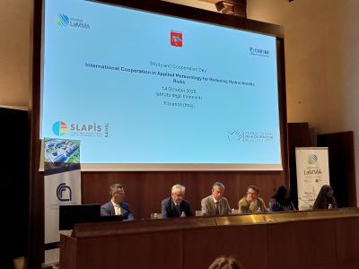 Five people sit at a panel discussion during the "International Cooperation in Applied Meteorology for Reducing Hydroclimatic Risks" event in Florence, Italy, on October 14, 2025.